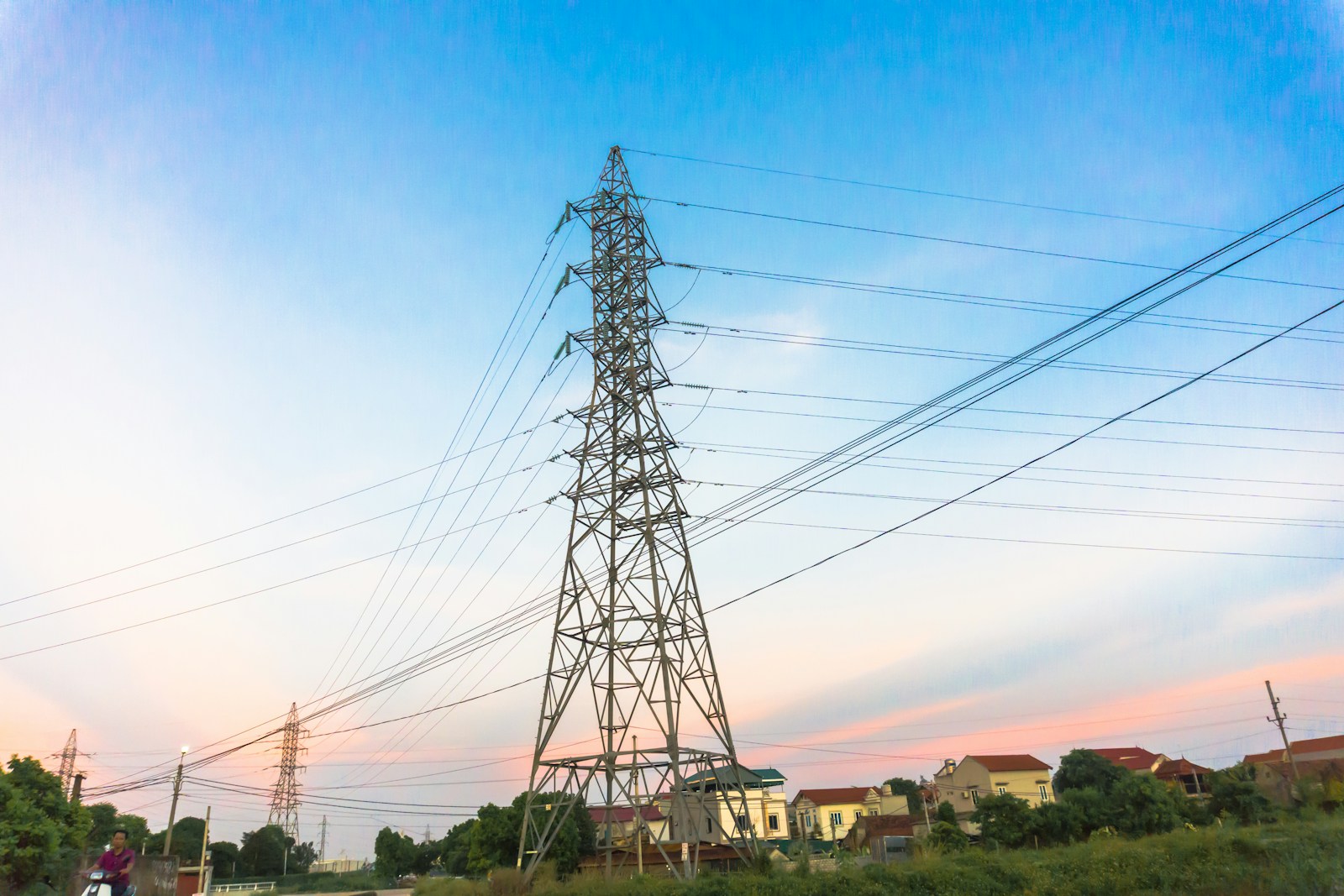 black electric tower under blue sky during daytime