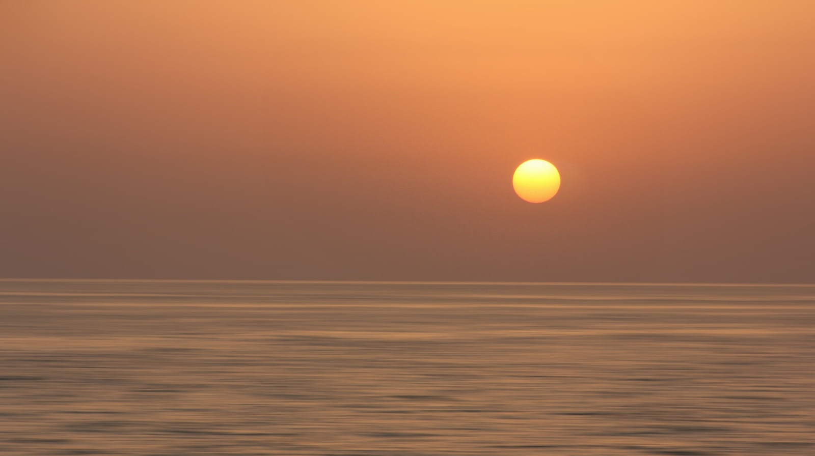 body of water during sunset